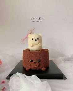 there is a cake with a teddy bear on it