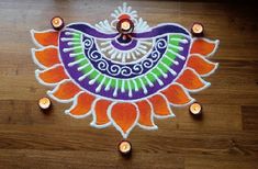 a decorated rangdi with candles on the floor