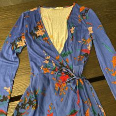 Dvf Wrap Dress In Blue Floral Print. Size Xs-S. It’s A Piece Which Was Bought At A Sample Sale So It Doesn’t Have A Size Tag On It. Also This Dress Is Unique In That The Top Half Of The Dress Is A Soft Jersey Like Material And The Bottom Half Is Silk. Beach V-neck Printed Wrap Dress, Elegant Floral Print V-neck Wrap Dress, V-neck Floral Print Wrap Dress For Daywear, Dvf Wrap Dress, Wrap Dress Diane Von Furstenberg, Diane Von Furstenberg Wrap Dress Dvf, Sample Sale, Diane Von Furstenberg, Dresses Xs