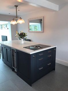 a kitchen island with an oven and sink