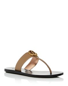 Chic Gucci Sandals With Single Toe Strap, Gucci Designer Sandals With Single Toe Strap, Designer Gucci Sandals With Single Toe Strap, Elegant Gucci Flat Sandals, Luxury T-strap Sandals For Beach, Gucci Luxury Sandals For Summer, Luxury Gucci Sandals For Summer, Luxury T-strap Beach Sandals, Designer Toe Post Sandals