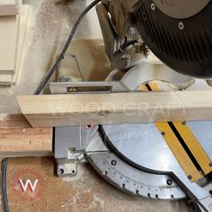 a circular saw is being used to cut wood