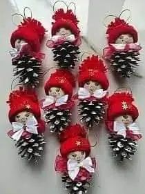 red and white christmas decorations with pine cones