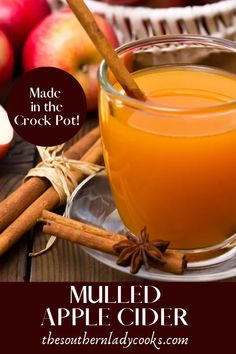 mulled apple cider made in the crock pot with cinnamon sticks and apples