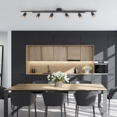 a dining room table surrounded by chairs and cabinets