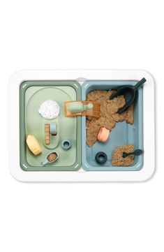 a plastic tray filled with food and utensils