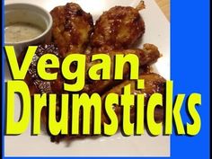 the words vegan drumsticks are in front of a plate with dipping sauce