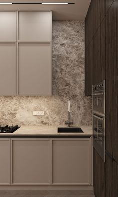 a kitchen with white cabinets and marble counter tops