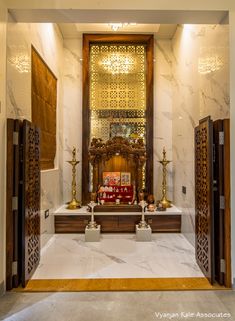 the interior of a building with marble floors and walls, decorated in gold trimmings