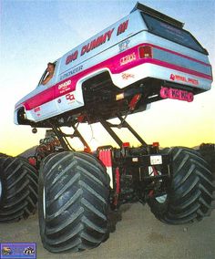 the monster truck has four large tires on it's back