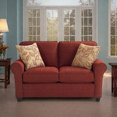 a living room scene with focus on the couch and coffee table in the foreground