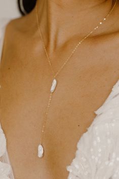 Elevate your jewelry collection with our new Kiara Pearl Y Necklace! Each piece is lovingly handcrafted with freshwater biwa stick pearls, known for their unique and organic shapes, making every necklace truly one-of-a-kind! The delicate yet durable cable chain is available in your choice of 14k gold filled, rose gold filled, or sterling silver, providing you with a luxurious and versatile accessory that will complement any outfit. Make a beautiful statement with the Kiara Pearl Y Necklace! NECK V Neck Necklace Guide, Long Drop Pearl Necklace With Adjustable Chain As Gift, Long Drop Pearl Necklace With Pendant For Gift, Long Drop Pearl Pendant Necklace As Gift, Pearl Lariat Necklace As A Gift, Long Drop Pearl Charm Necklace As Gift, Long Drop Pearl Charm Necklace For Gift, Long Drop Pearl Drop Necklace As Gift, Long Drop Pearl Necklace Gift