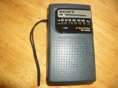 an old style radio sitting on top of a wooden table