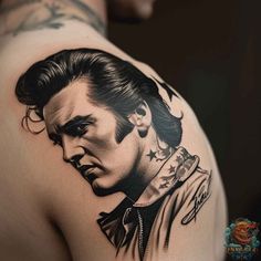 a man's back with a portrait of elvis presley tattoo on his left shoulder