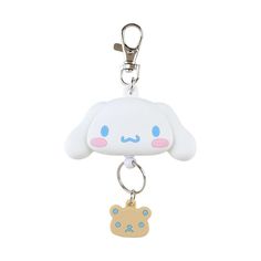 a keychain with a cute little dog on it's front and back ends