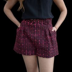 Upgrade Your Summer Wardrobe With Lavender Brown's Laura Shorts In A Playful Pink And Black Tweed Design. These Belted Shorts Effortlessly Combine Style And Comfort, Making Them A Versatile Addition To Your Collection. Perfect For Any Occasion, These Shorts Are A Must-Have For Any Fashion-Forward Wardrobe. Trendy Short Pink Pants, Trendy Pink Short Length Pants, Trendy Short-length Pink Pants, Trendy Short Length Pink Pants, Chic Pink Shorts, Pink Short Length Pants For Spring, Pink Party Bottoms With Built-in Shorts, Fitted Pink Shorts With Pockets, Pink Shorts With Belt Loops