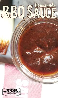 a jar of barbecue sauce sitting on top of a table