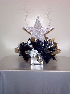 a silver table topped with a star centerpiece