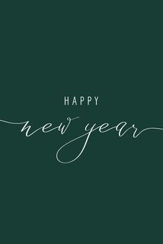 the words happy new year written in cursive writing on a dark green background