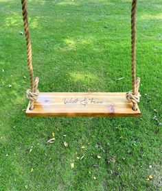 a wooden swing with rope hanging from it