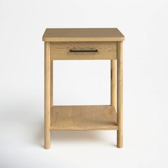 a small wooden table with a drawer on it