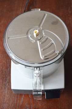 a food processor sitting on top of a wooden table