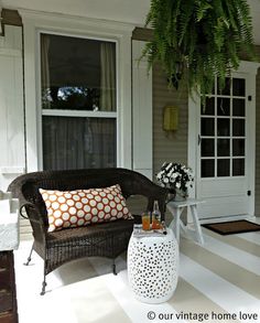 the front porch is clean and ready for guests to use