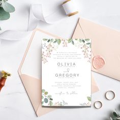 wedding stationery with flowers and leaves on it