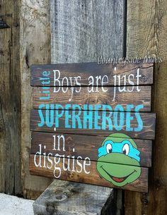 a wooden sign that says boys are just superheros in disguee on it