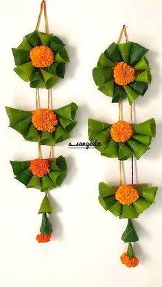 four pieces of paper with flowers and leaves attached to them