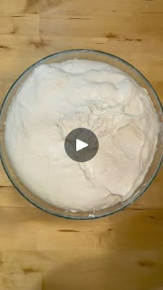 a bowl filled with white powder on top of a wooden table