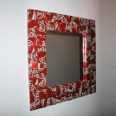 a coca cola sign frame hanging on the wall