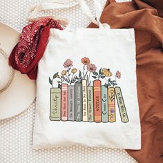 "Custom Book Shelf Tote Bag. BAG DIMENSIONS Height: 15.75\" Width: 15.25\" Handle 21.5\" FABRIC -100% Cotton -Reinforced Handle CARE INSTRUCTIONS - Wash inside out with cold water - Air dry or tumble dryer on low RETURNS AND EXCHANGES  Our tote bags are custom printed just for you so we do not accept returns or exchanges due to size. If there are any issues with the product please message us, and we will replace it as soon as possible. Policy We are not responsible for any duty/import/taxes/customs/etc charges you may incur.  We do not refund postage for lost, unclaimed, or undeliverable packages.  We are not responsible for any delays that may occur at customs. ⭐Back to our shop⭐ https://www.etsy.com/ca/shop/RajoTuuloShop Don't hesitate to contact us with any questions or problems with yo Book Totes Diy, Book Tote Bag Painting Ideas, Bookish School Bags With Letter Print, White Bookish Bag For Everyday Use, White Bookish Bags For Daily Use, White Bookish Bag For Daily Use, Book Bag Ideas, Tote Design Ideas, Bookish Tote Bag