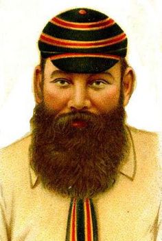 a man with a long beard wearing a hat and striped tie on top of his head