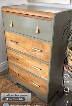 an old dresser is painted green and has brass hardware on the top, along with a potted plant