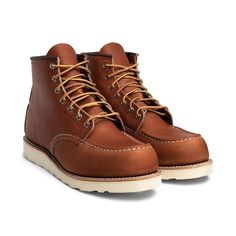 Much the same as the first moc-toe boots made by the company in the 1950s, the Red Wing Heritage Classic Moc Boot is a quality shoe with a timeless design. Its upper is crafted from either premium Oro Legacy or Black Harness leather, and joined to a Traction Tred rubber outsole with a Goodyear leather welt. A cork midsole provides comfort while triple stitching and Taslan laces offer added durability. The nature of the USA-made construction allows Red Wing (or other shoe experts) to resole the b Red Wings Boots, Black Harness, Wing Boots, Moc Toe Boots, Rugged Boots, Red Wing Boots, Red Wing, Toe Boots, Red Wings