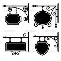 black and white signs hanging from metal brackets