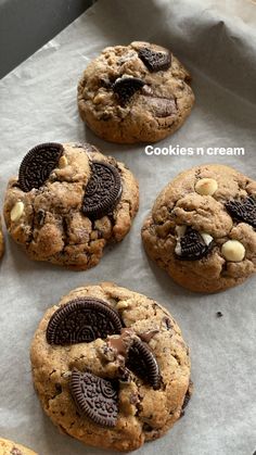 chocolate chip cookies and oreo cookies are on the baking sheet, ready to be eaten