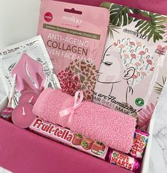 a pink gift box filled with beauty products