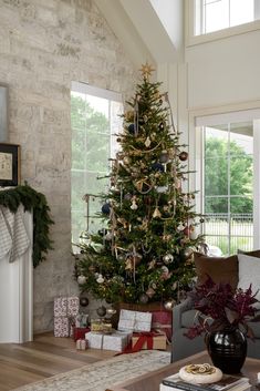 a living room with a christmas tree in the corner