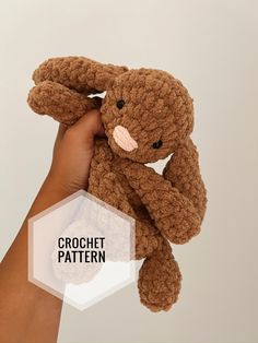 a hand holding a brown crochet bunny with the text crochet pattern below it