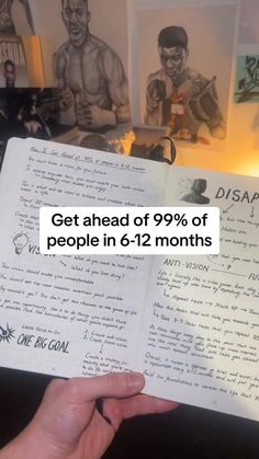 someone is holding up an open notebook with drawings on the wall behind them that says get ahead of 99 % of people in 6 - 12 months