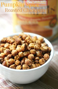 a white bowl filled with nuts on top of a table