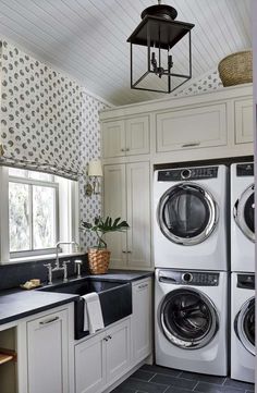 a washer and dryer sitting in a kitchen next to each other on top of a counter