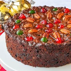 there is a chocolate cake with nuts on it