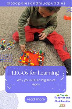 a young boy playing with legos on the floor in front of an advert