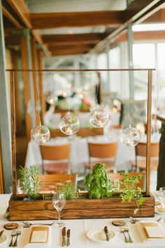 the table is set with plates and silverware, napkins and place settings for an event