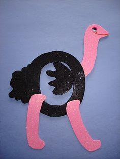 an ostrich made out of foam with pink and black paint