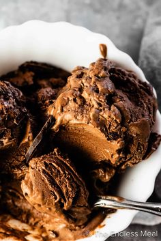 a bowl filled with ice cream and chocolate