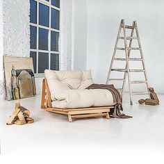 a chair and ladder in an empty room